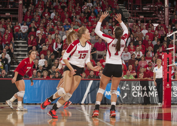 Wisconsin setter Lauren Carlini sets up Haleigh Nelson (13) for the slide against Western Illinois at the UW-Fieldhouse. PHOTO: Greg Anderson