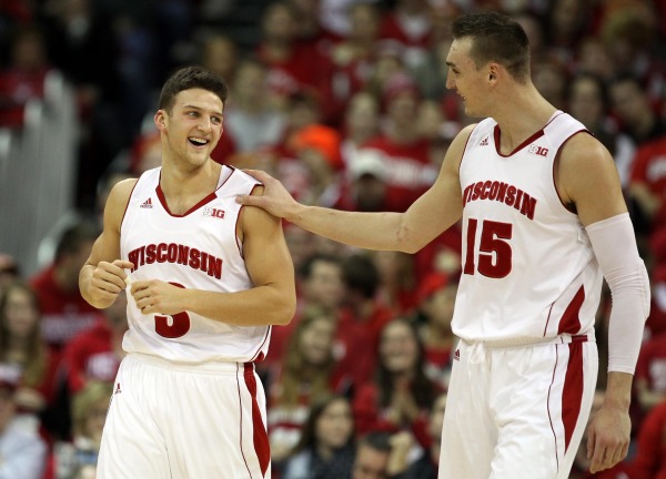 Wisconsin guard Zak Showalter (3) gets a pat on the shoulder from teammate Sam Dekker (15) at the Kohl Center. PHOTO: Mary Langenfeld (USA TODAY)