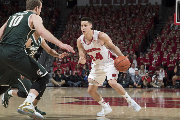 Bronson Koenig (24) drives toward the basket during the Badgers' 68-61 win over Michigan State on March 1 at the Kohl Center. PHOTO: David Stluka