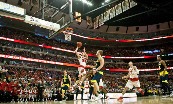 Koenig scores 12, Badgers move to semis