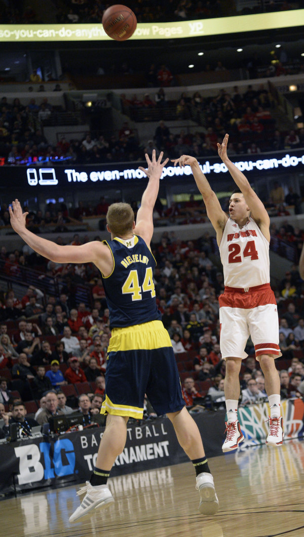 Wisconsin guard Bronson Koenig (24) shoots over Michigan forward Max Bielfeldt (44) in the first half in the quarterfinals of the Big Ten Tournament at the United Center. PHOTO: David Banks, USA TODAY