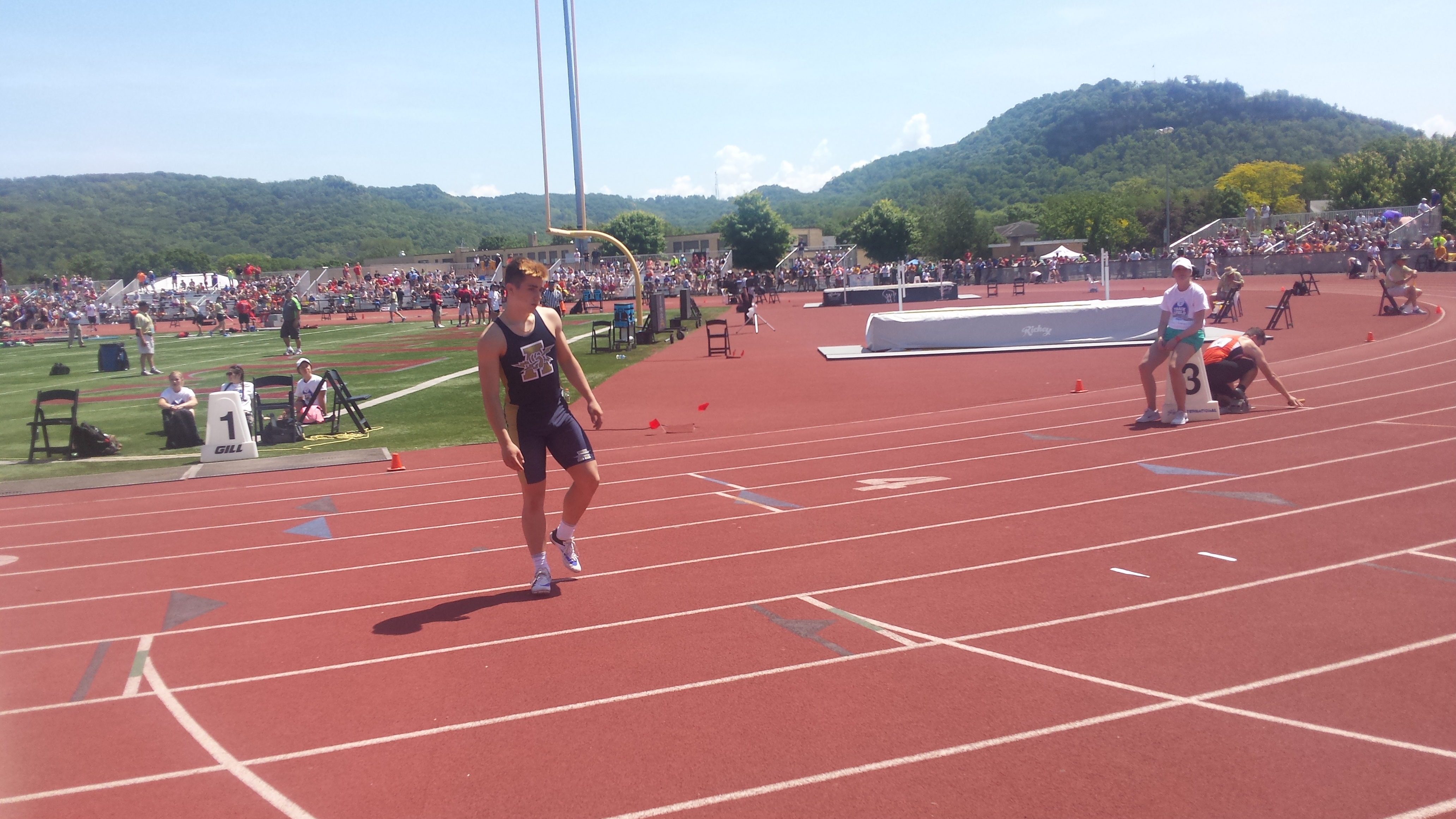 Nick Cambio (Aquinas) prepares for 800 relay.