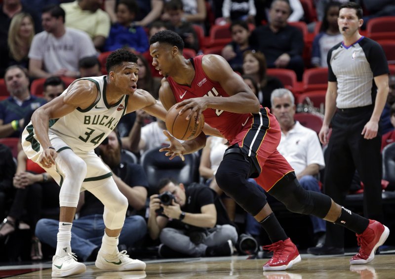 Bucks fall to surging Heat, move to eighth spot in East