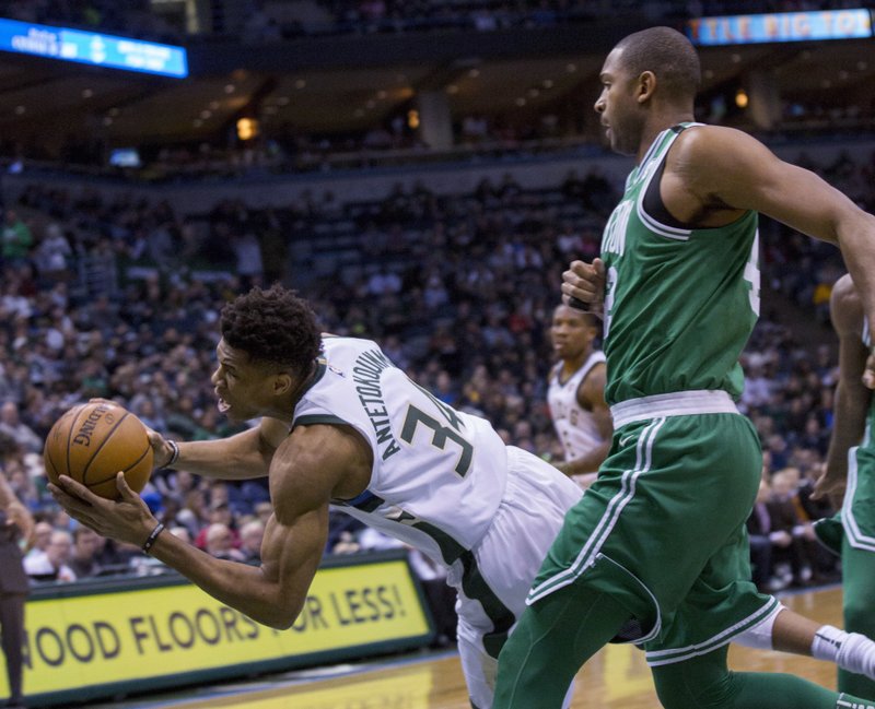 Bucks inch closer to playoff spot, beat short-handed Celtics