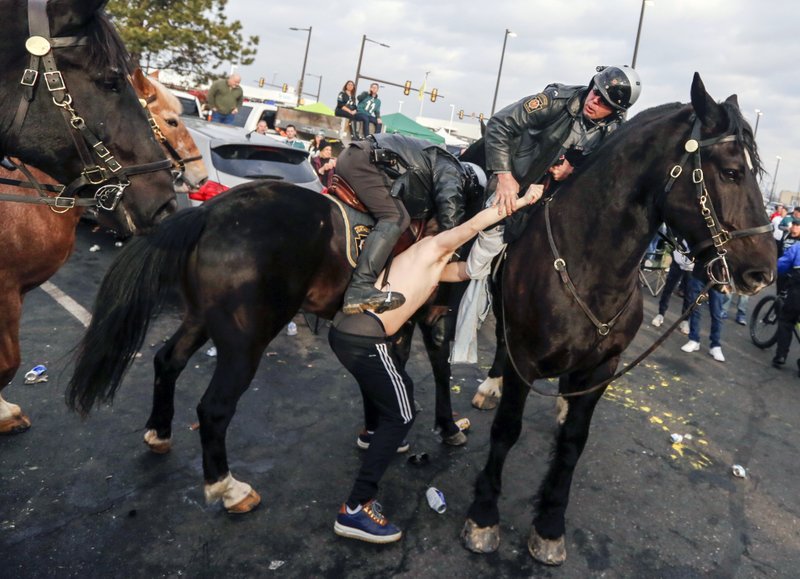 Eagles fan accused of punching police horse sues team, cops