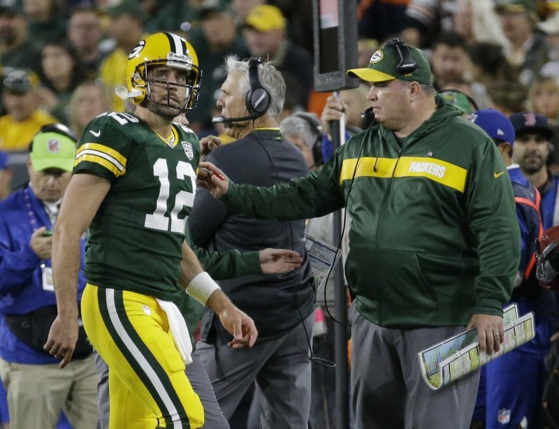 WATCH: Rodgers heads onto field in bulky brace