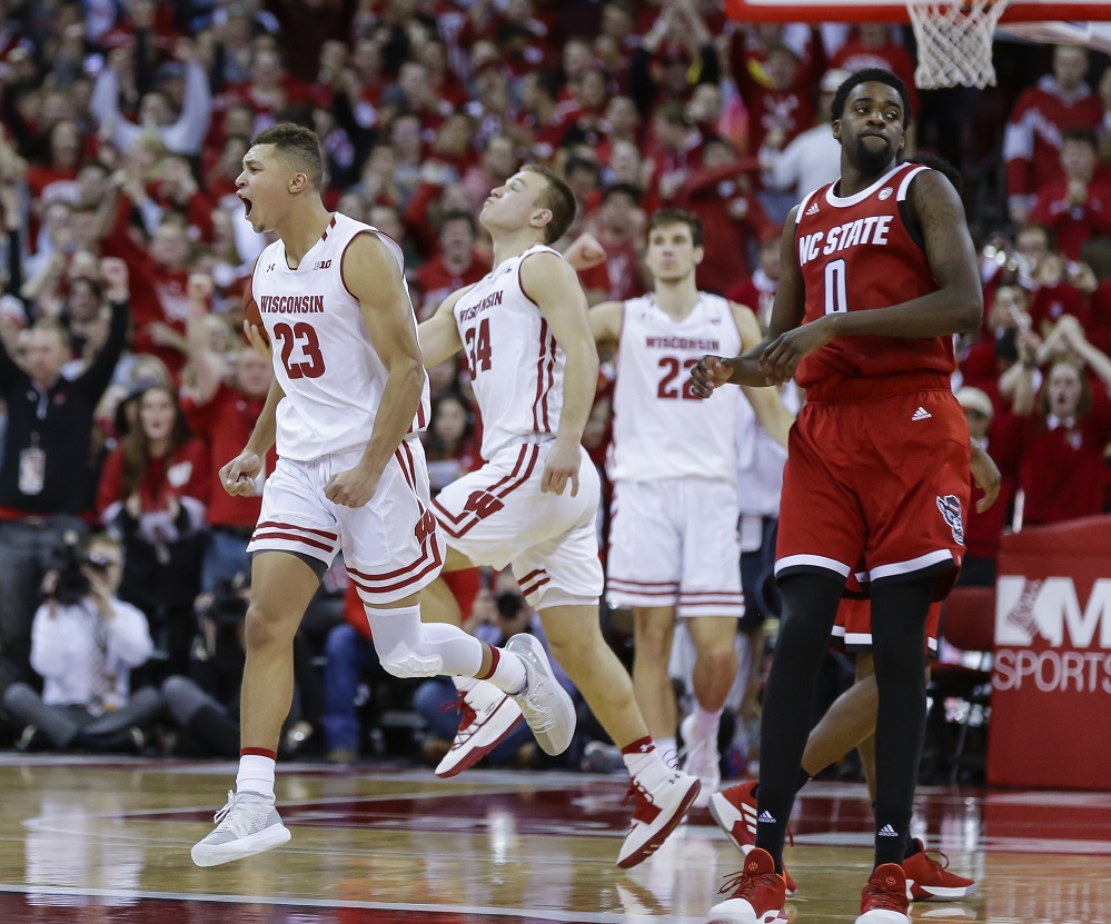 Happ’s double-double helps Badgers hold off NC State