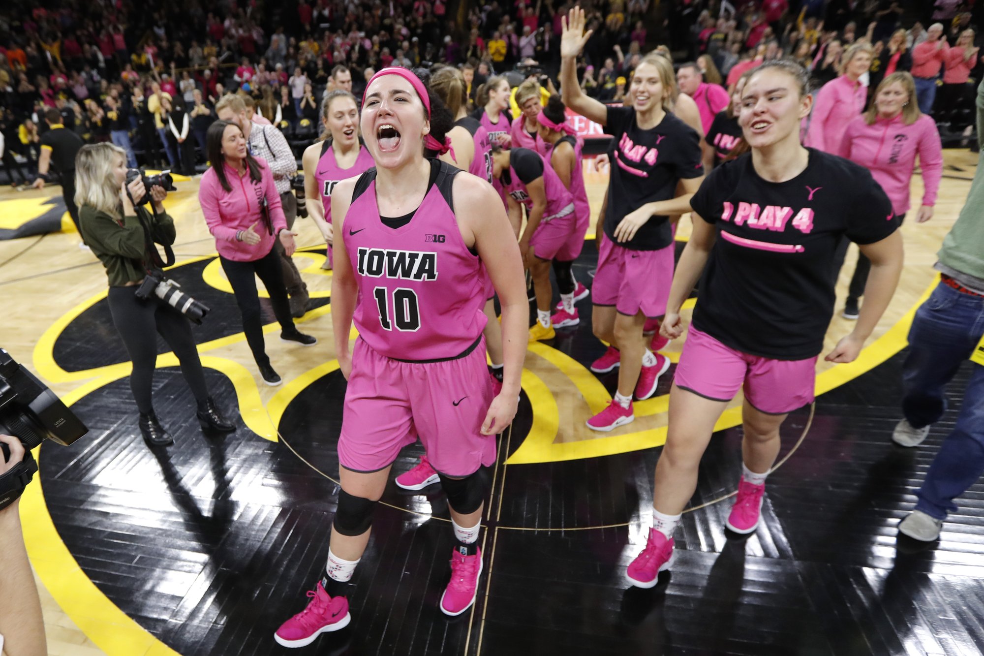 Why is iowa women's basketball wearing pink