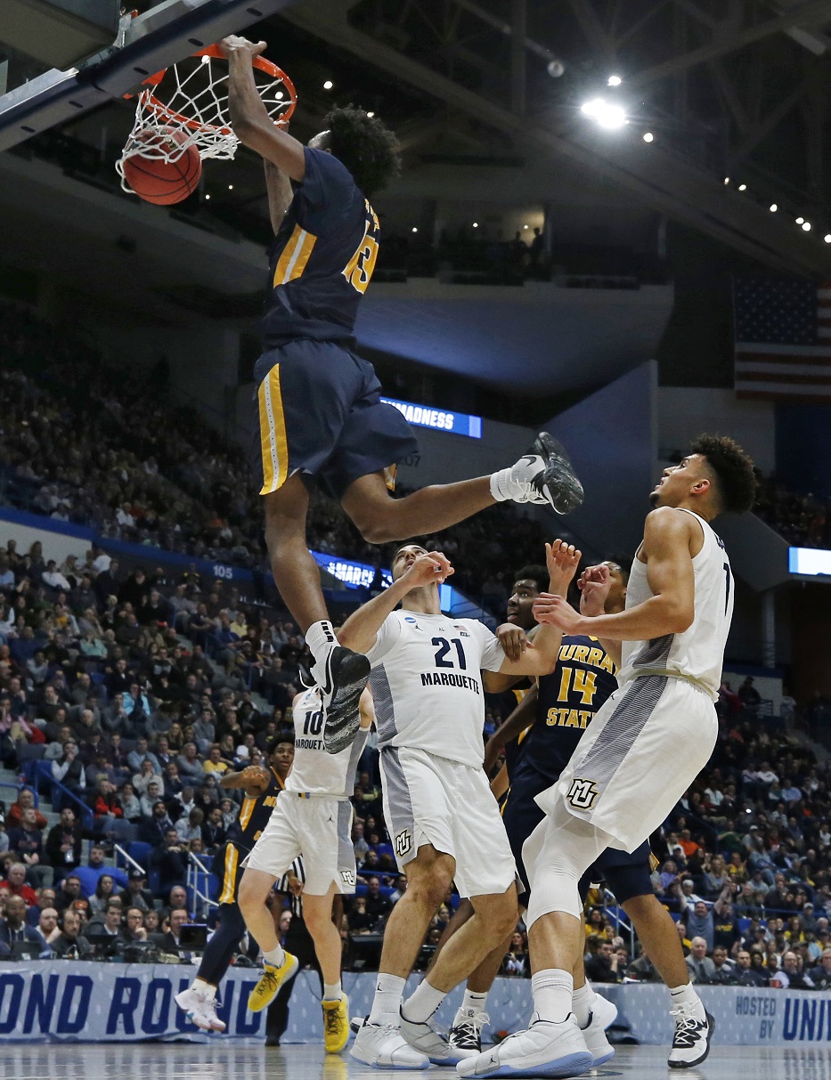 Morant’s triple-double leads Murray St upset over Marquette
