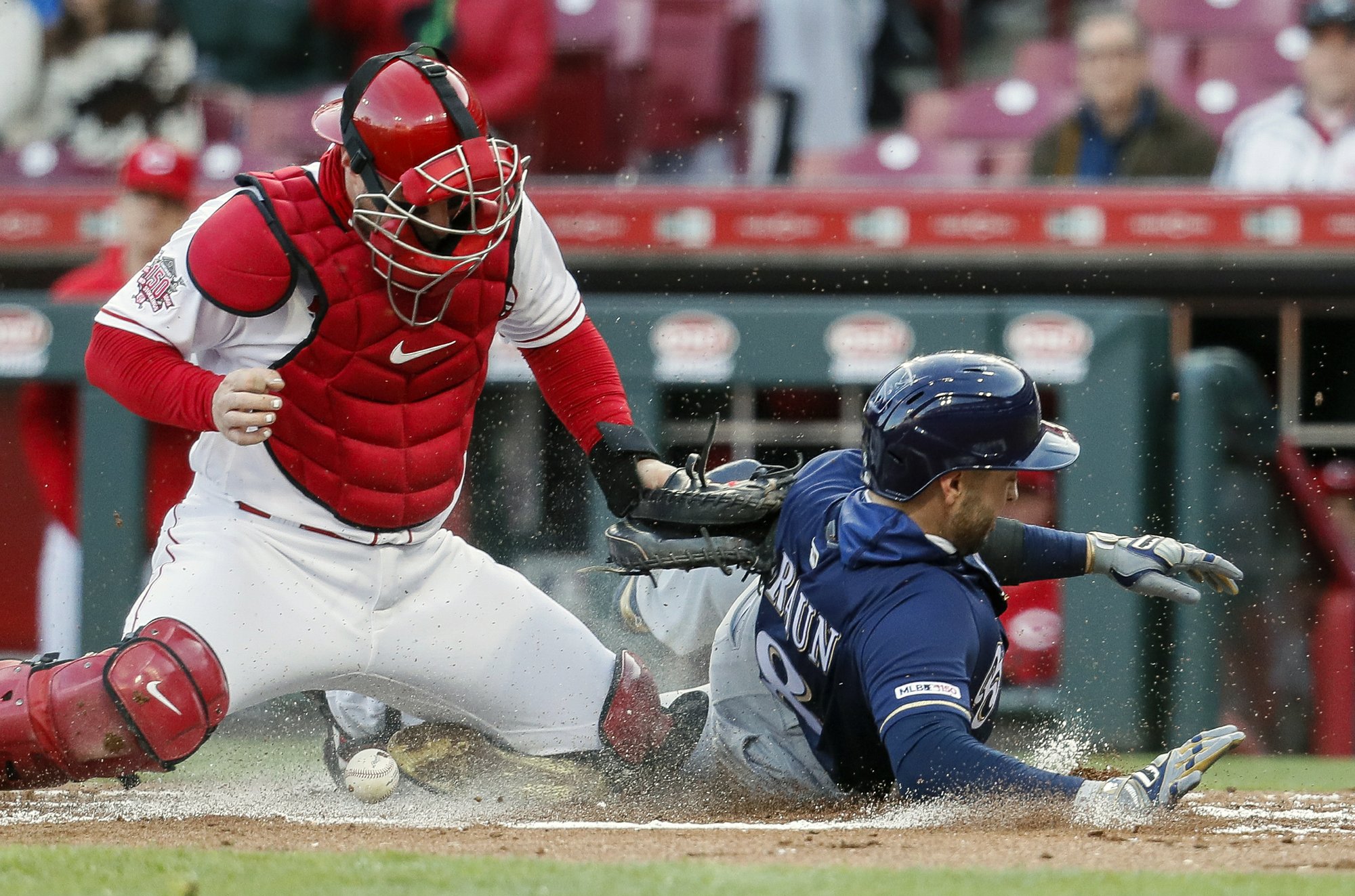 Yelich homer streak snapped, but Brewers hold off Reds
