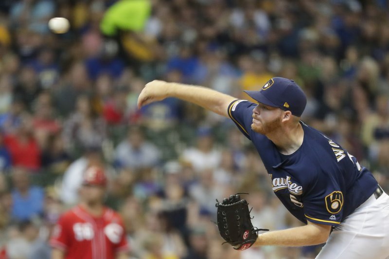Woodruff strikes out career-high 12, Brewers beat Reds 7-5