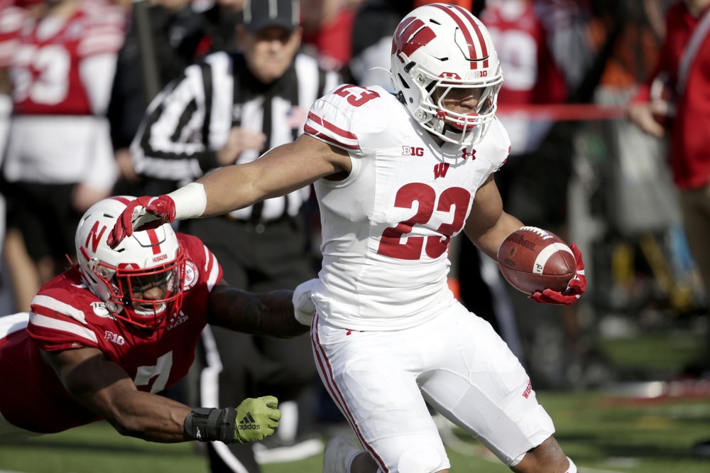 With over 200 yards again, Taylor passes Herschel Walker in record books, as Badgers win