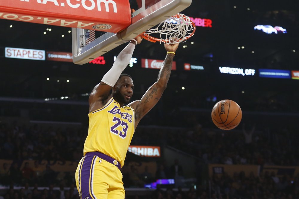 LeBron sets triple-double mark, Lakers hold off OKC 112-107
