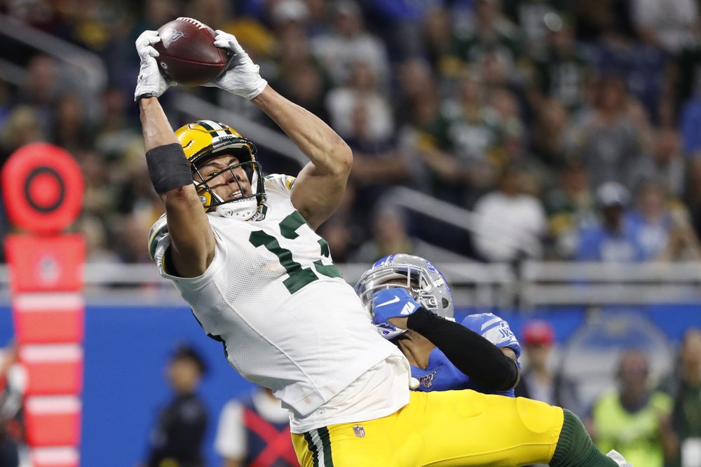 Packers barely beat Lions 23-20 to earn first-round bye