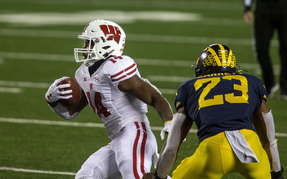No. 13 Wisconsin routs Michigan 49-11 in 1st game in 3 weeks