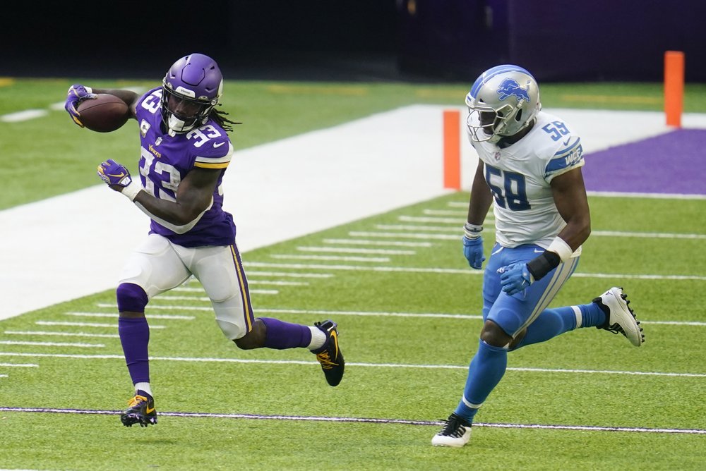 Cook runs over Lions, Vikings rough up Stafford in 34-20 win