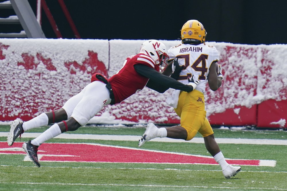 Gophers, missing 33 players, stun Huskers 24-17 after layoff