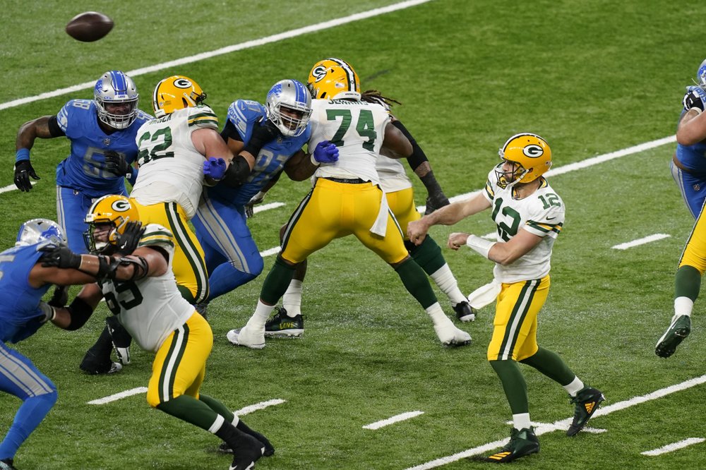 Rodgers-led Packers beat Lions 31-24, clinch NFC North title