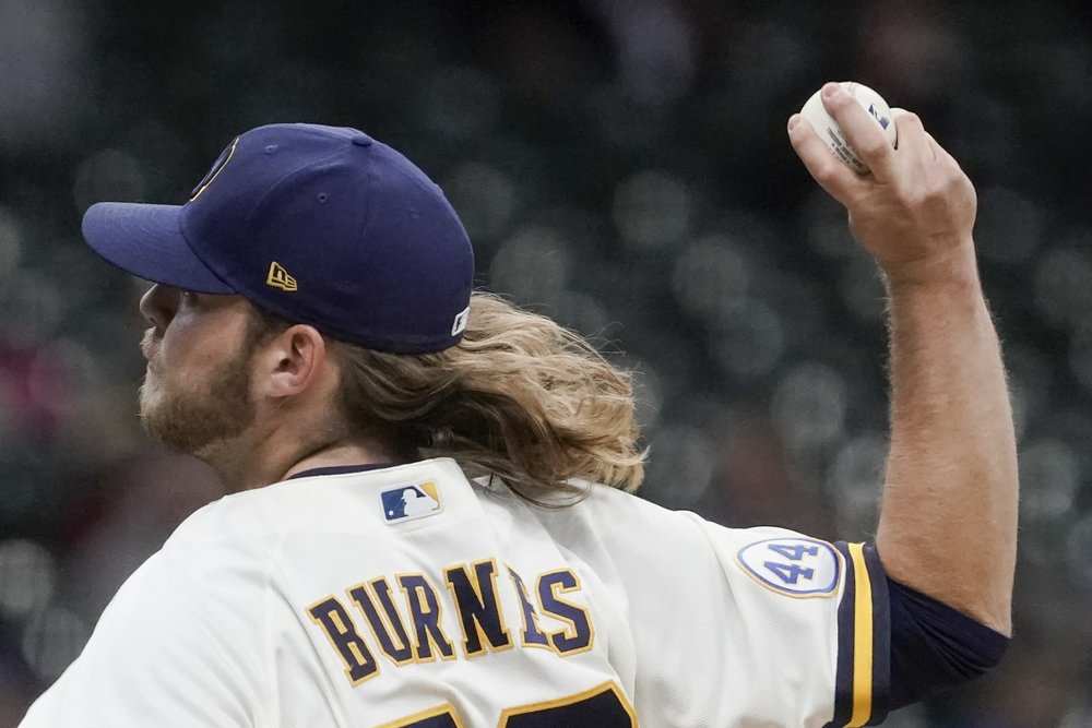 Burnes delivers with arm, bat as Brewers trounce Cubs 7-0