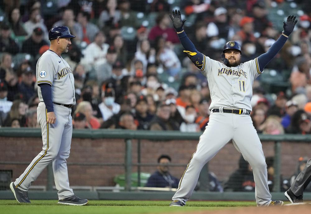 Cain homers, Woodruff pitches Brewers past Giants 6-2
