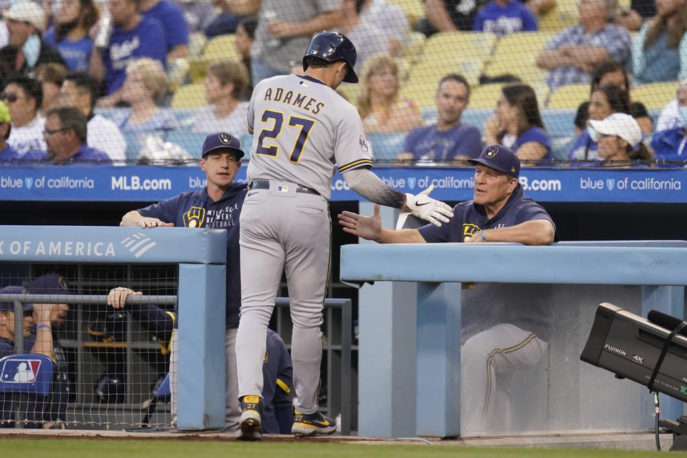 Urías wins 20th, LA beats Brewers 8-3 to stay alive in West