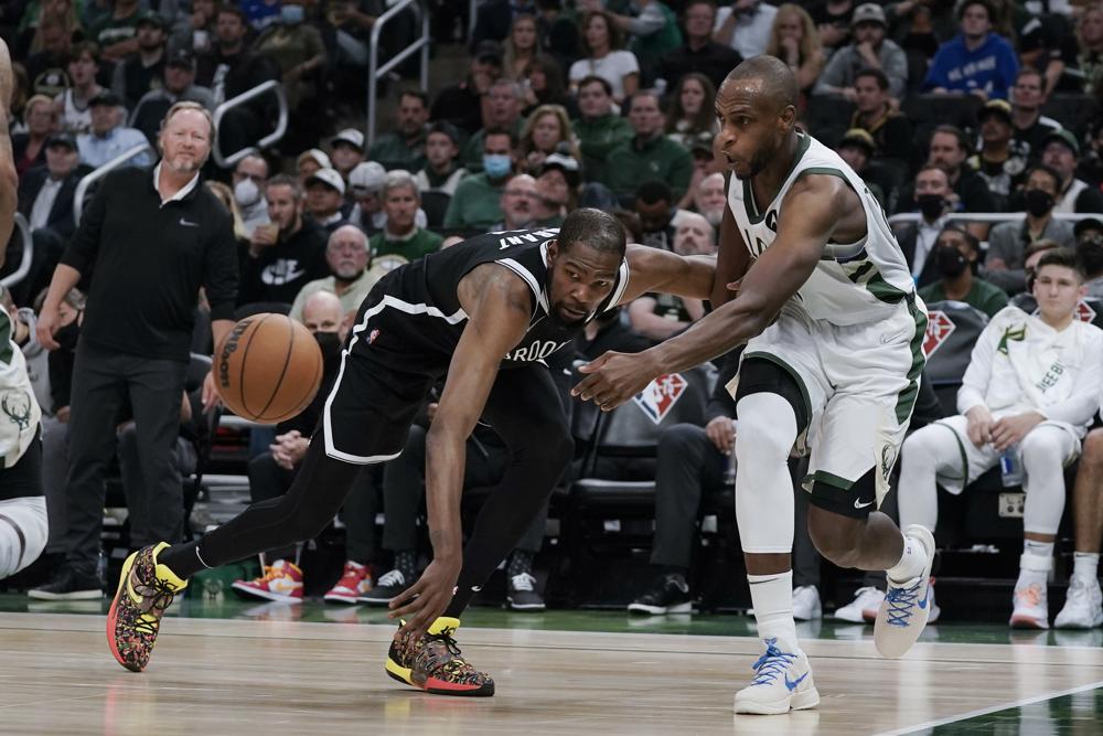 Bucks begin title defense with blowout win over Nets
