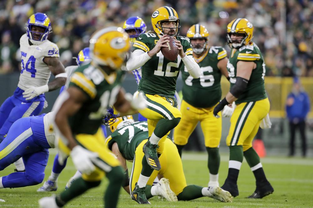 Toe injury can’t stop Rodgers as Packers defeat Rams 36-28
