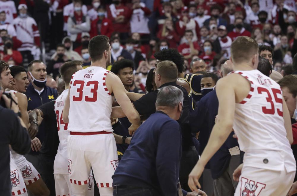 WATCH: Michigan coach Howard hits Wisconsin assistant after a loss