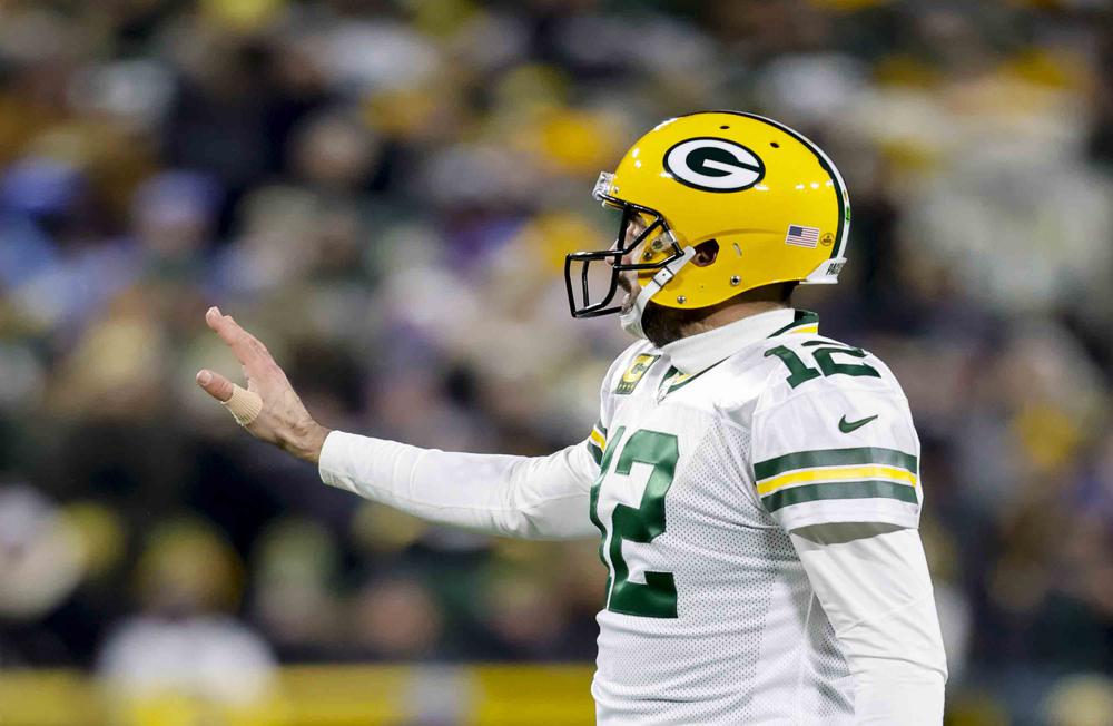 Rodgers-led Packers beat Lions 31-24 to win NFC North