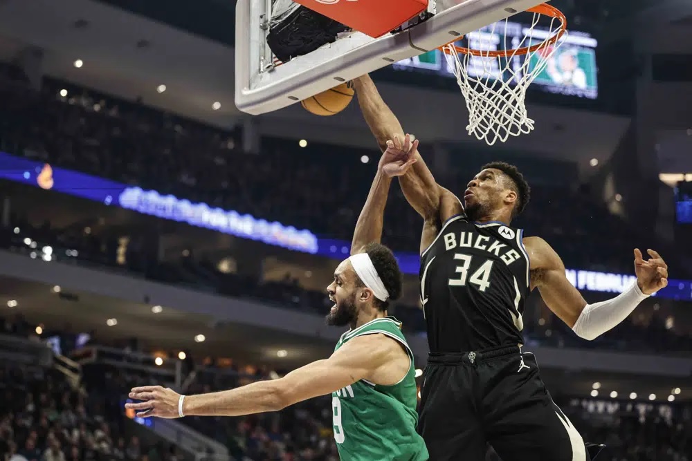 Bucks need 40 from Holiday and overtime to beat Celtics backups