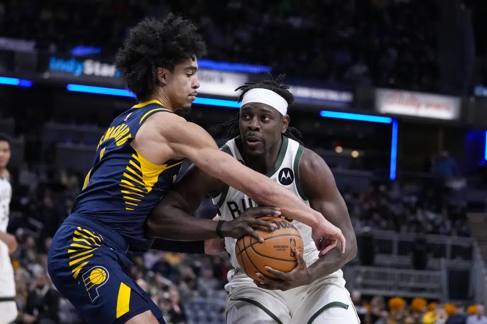 Holiday has career-high 51, Giannis gets triple-double, as Bucks beat Pacers