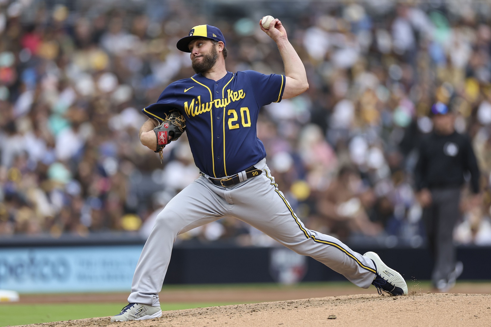 Brewers put LHP Wade Miley on injured list after he leaves start early with lat strain