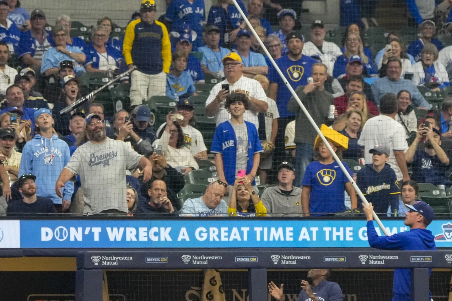 Bat flies, get stuck in net at Brewers game for 2 innings