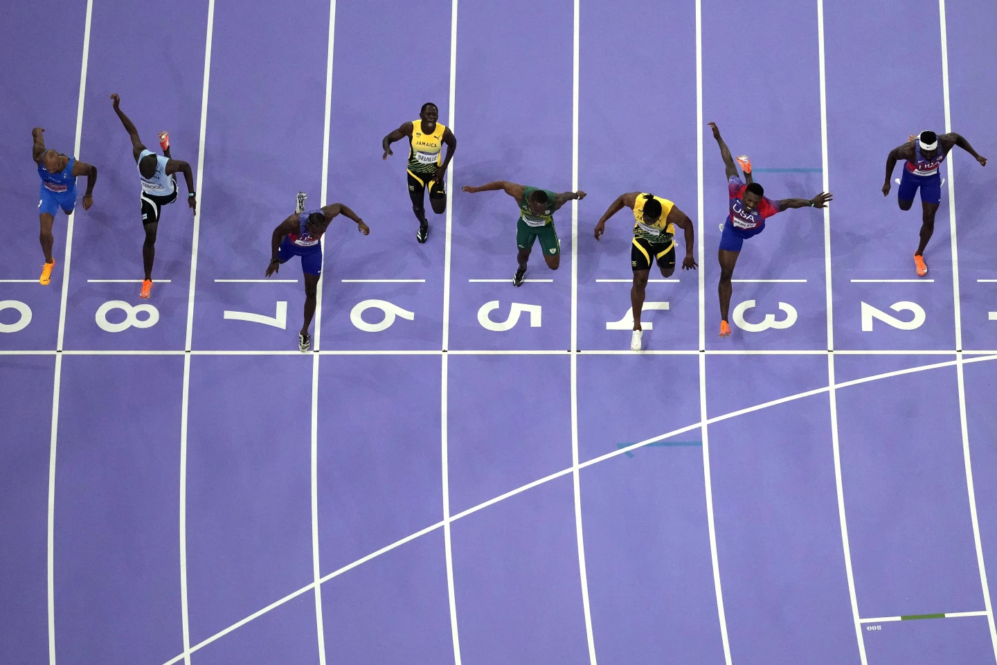 Noah Lyles wins a historically close Olympic 100-meter sprint by five-thousandths of a second