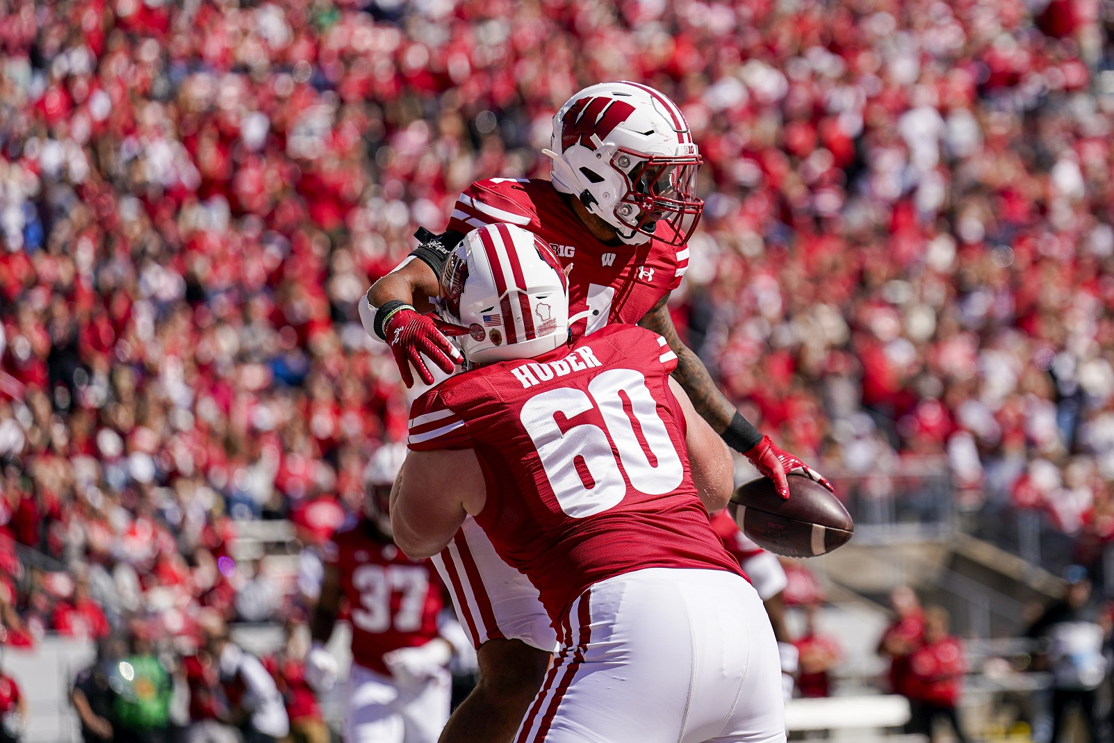 Day his grandfather died, Wisconsin’s Chez Mellusi rushes for 2 TDs as Badgers beat South Dakota