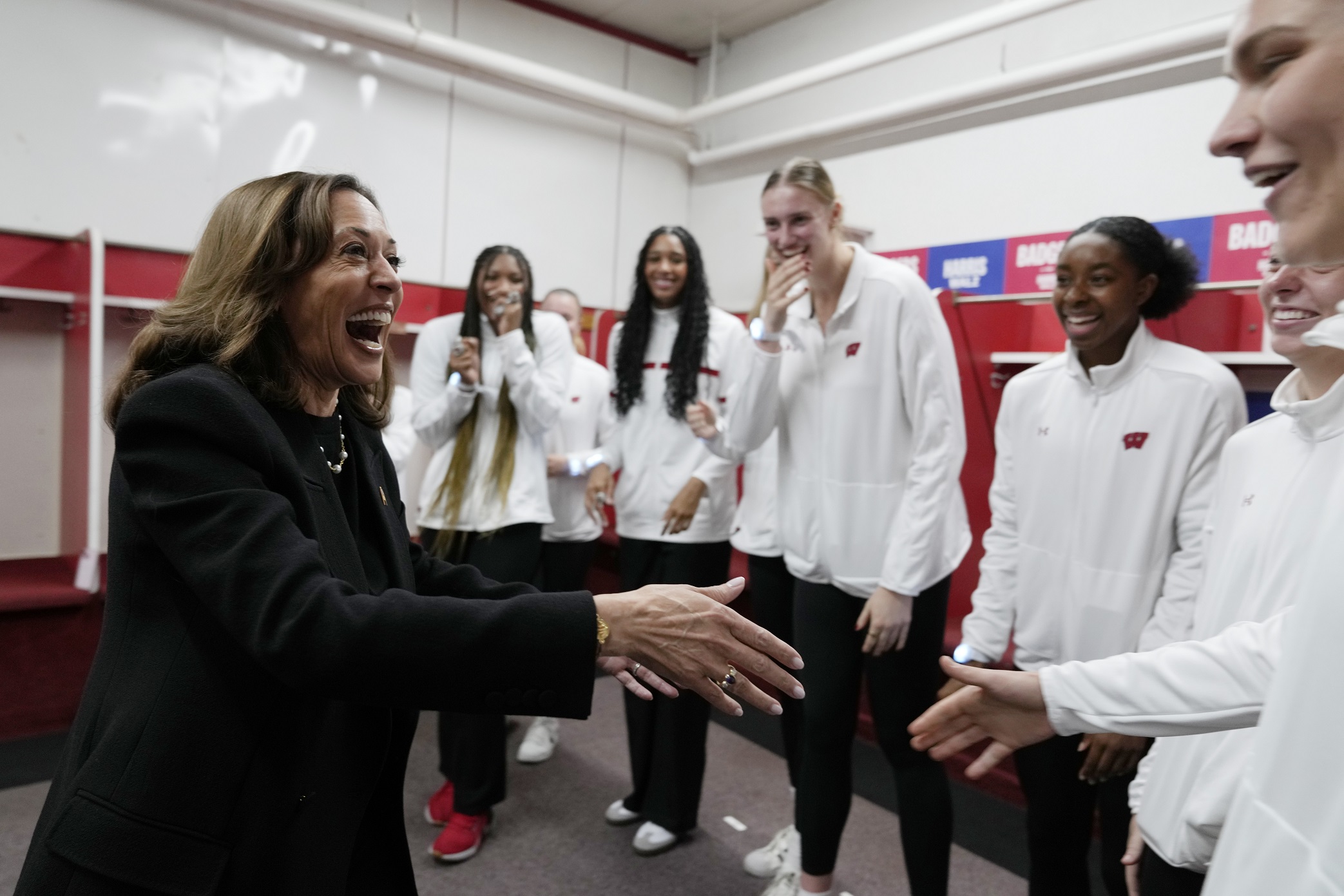 Kamala Harris rallies in Madison, greeted by Badgers volleyball team at rally