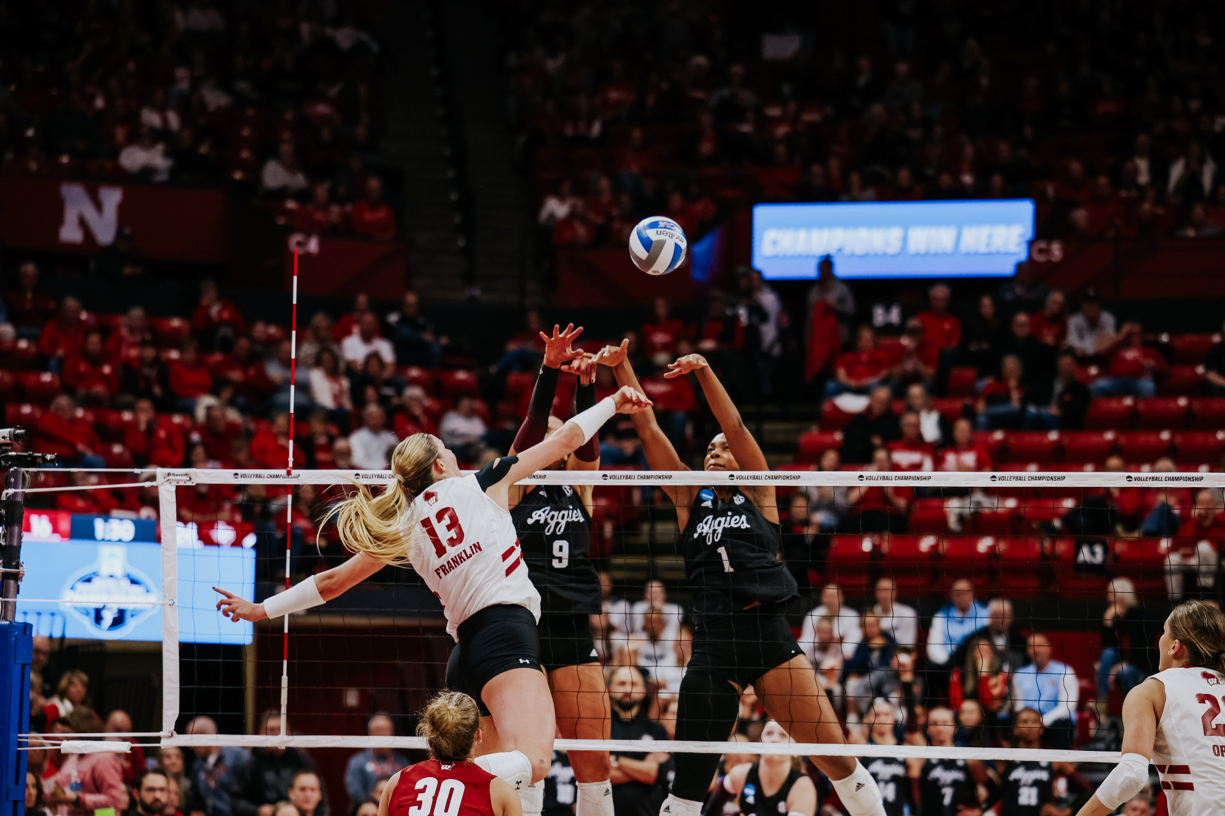 Badgers squeak into Elite Eight, will face nemesis Nebraska to see who gets back to Final Four; Marquette falls to Penn St.