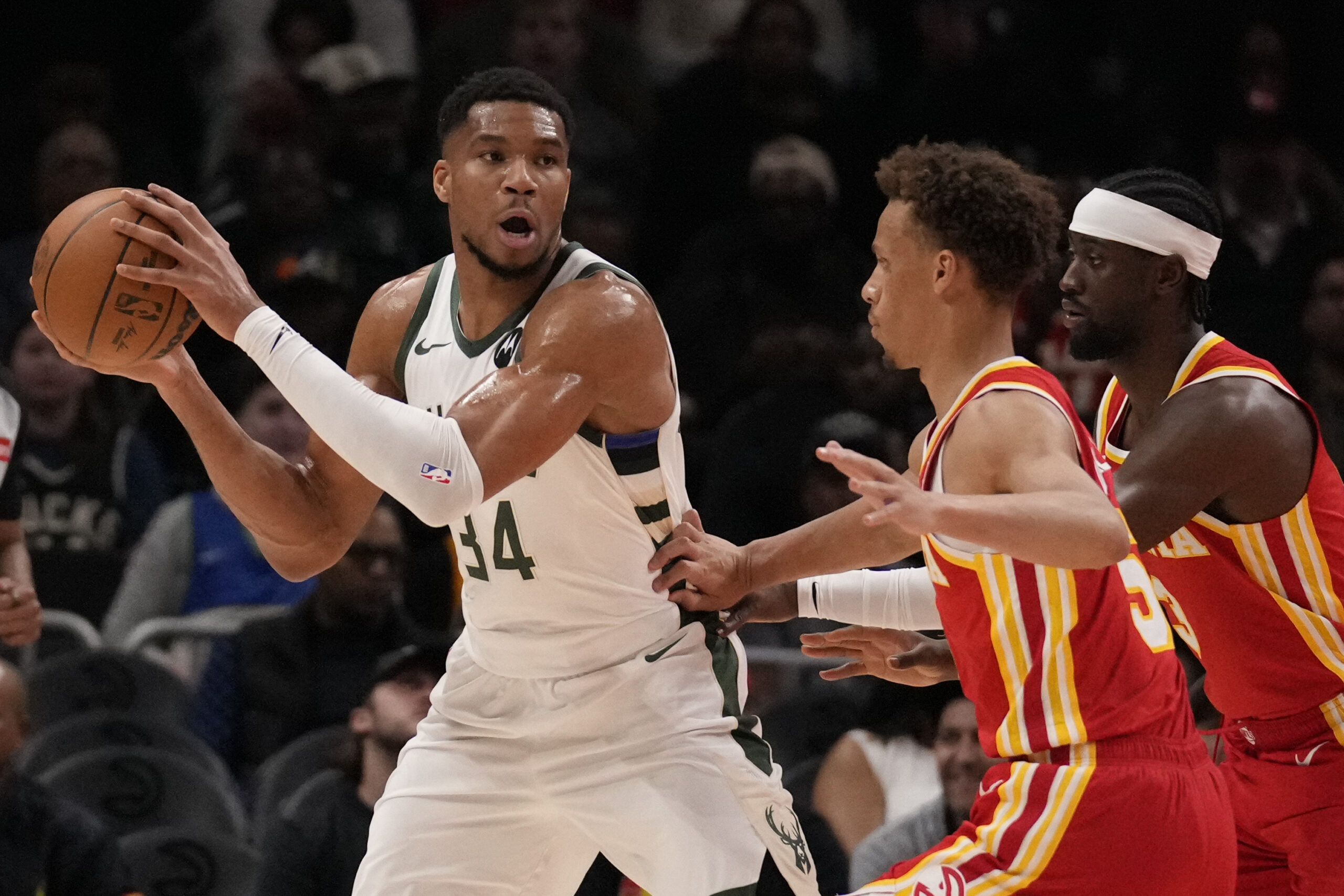 Giannis Antetokounmpo posts triple-double as surging Bucks finish strong to beat Hawks 127-121