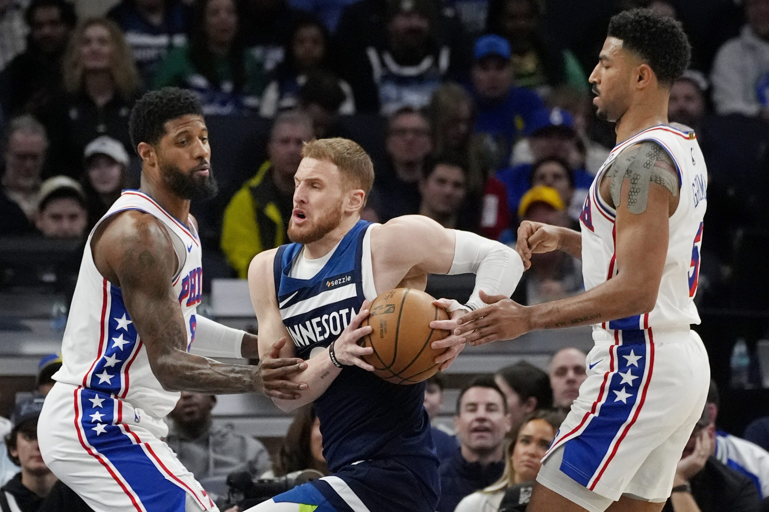 Reid scores 23 as Wolves pull away in fourth to beat 76ers 126-112